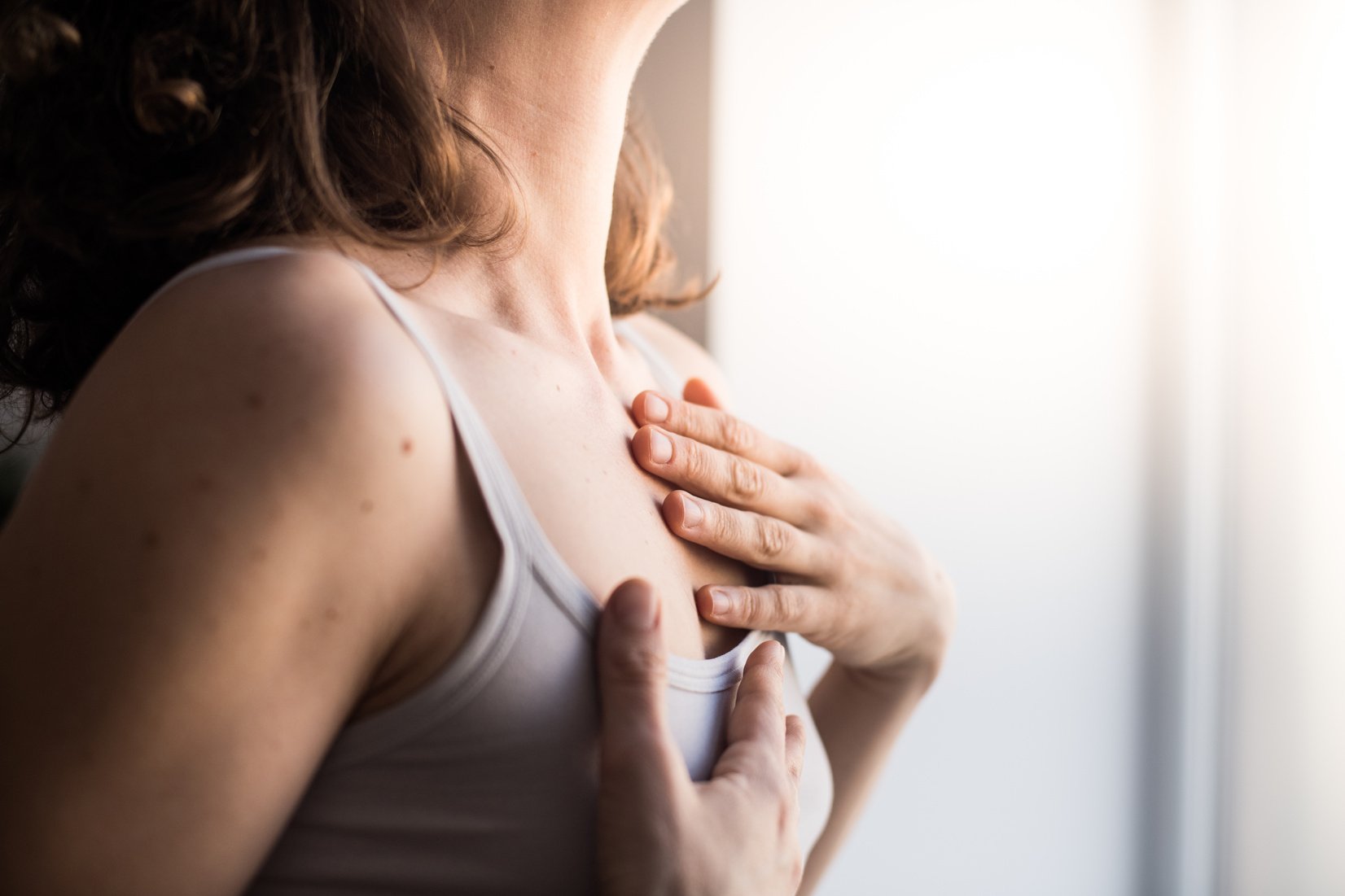 Woman hands touching her body close up, Embodiment, Feldenkrais Method and Awareness through movement